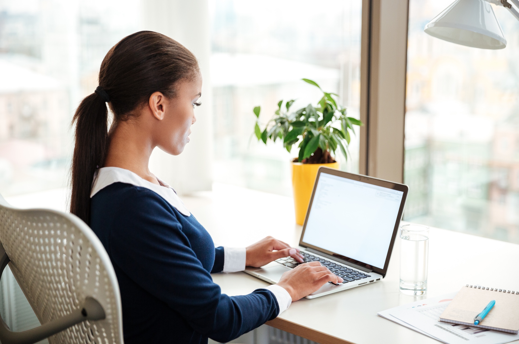 TEFL trainee studying on a laptop